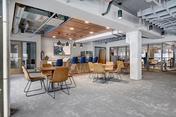 a large open space with tables and chairs at The Yards and Backyards, Minnesota, 55075