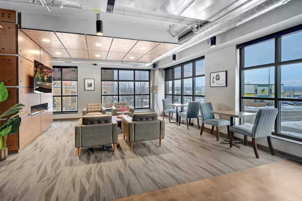 a room filled with furniture and a large window at The Yards and Backyards, Minnesota, 55075