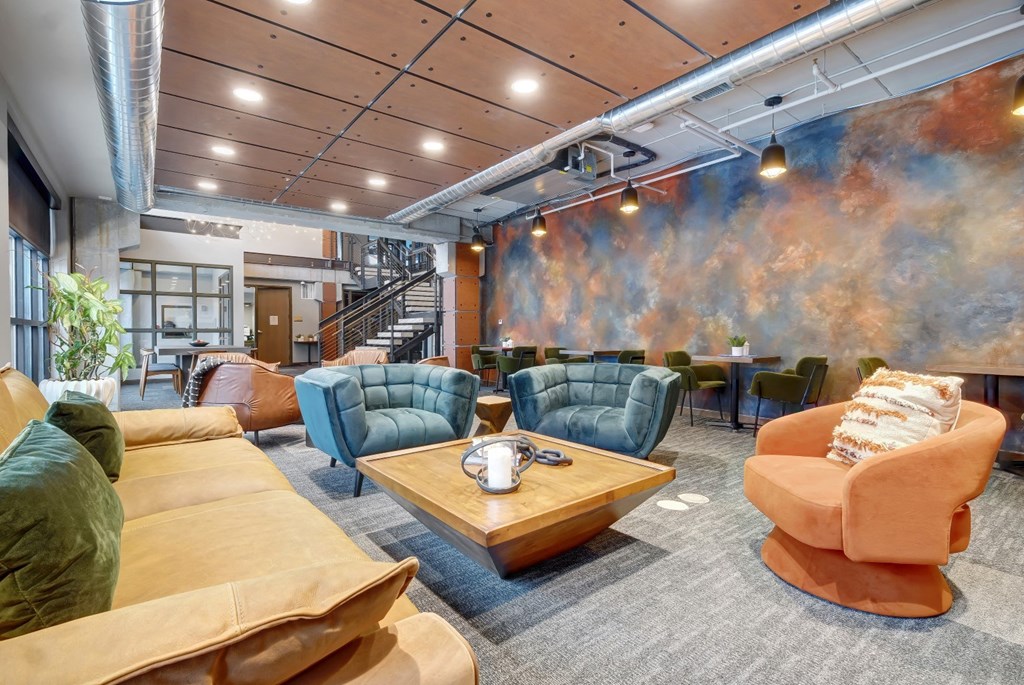 a large room with couches chairs and a coffee table