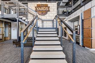 a staircase with a large sign that says the yards on the top of it at The Yards and Backyards, Saint Paul, Minnesota  55075
