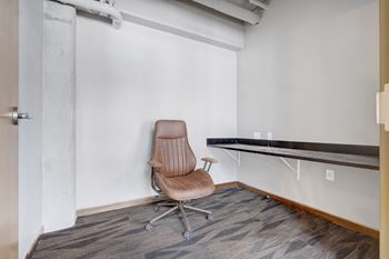 a workspace with a chair and a desk