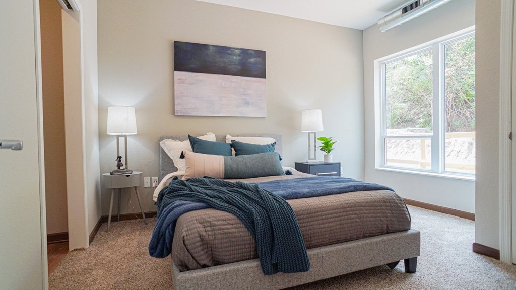 Bed lamps near bed at The Yards, South St. Paul