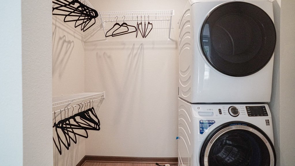 a washing machine and dryer in a laundry room at The Yards and Backyards, Minnesota, 55075