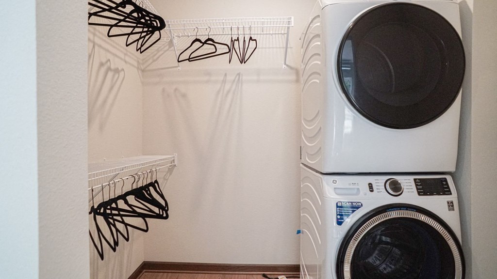 a washing machine and a dryer in a laundry room