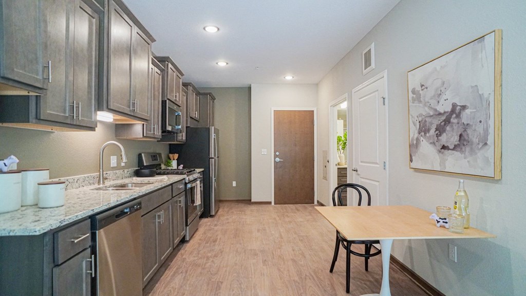a kitchen and dining area at The Yards and Backyards, Saint Paul, MN