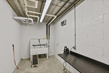 the interior of a white room with a sink and a counter