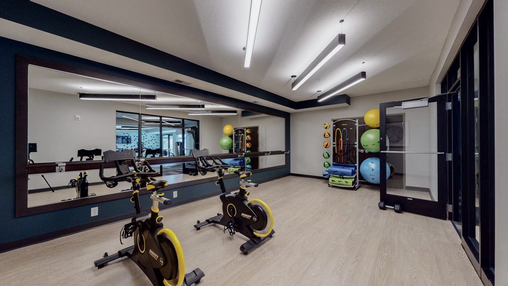 a gym with exercise equipment and weights at The Morrison, Rosemount Minnesota