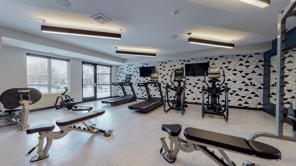 a fitness center with treadmills and other exercise equipment at The Morrison, Rosemount, MN