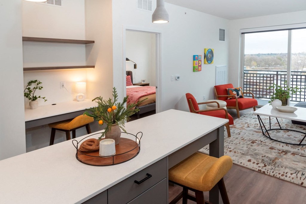 a kitchen and living room in an apartment