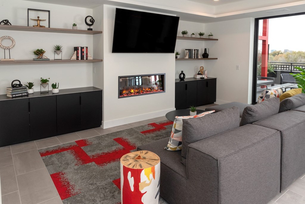 a living room with a couch and a fireplace