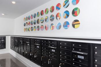 the wall of cabinets in a room with a bunch of rocks on it