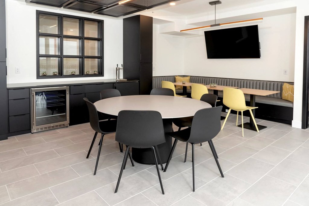 a conference room with a round table and chairs