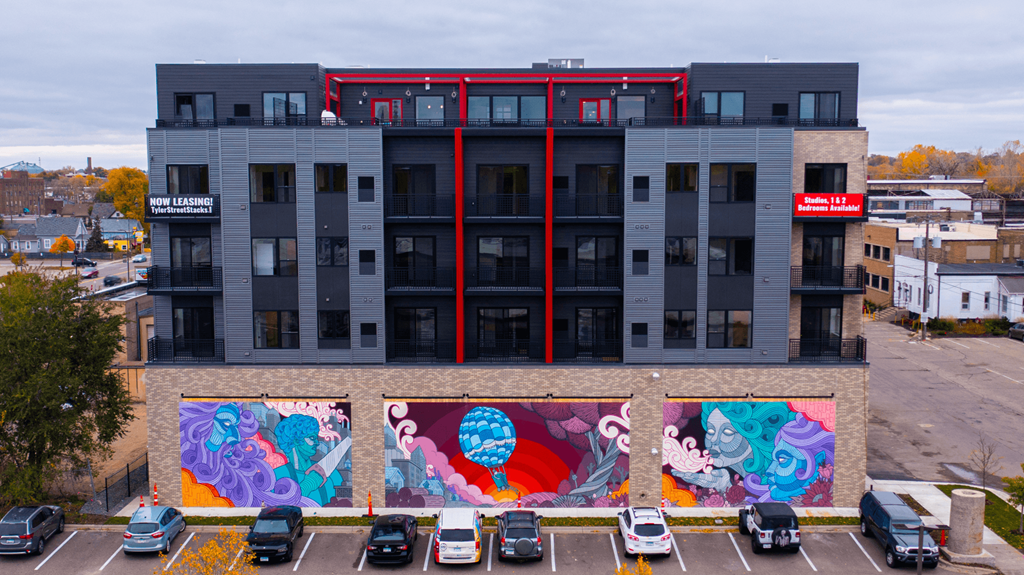 Tyler Street Stacks drone exterior image with mural on building