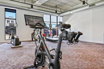 a gym with bikes and other exercise equipment