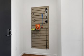 a towel rack hanging on a wall in a room with a door