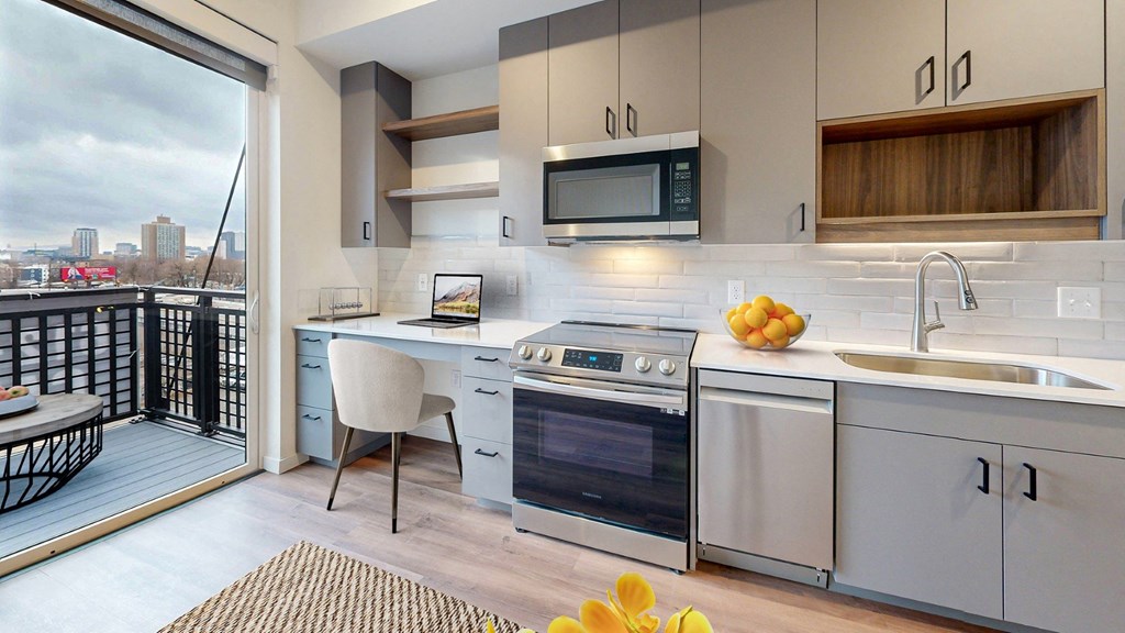 A modern kitchen with a view of the city.