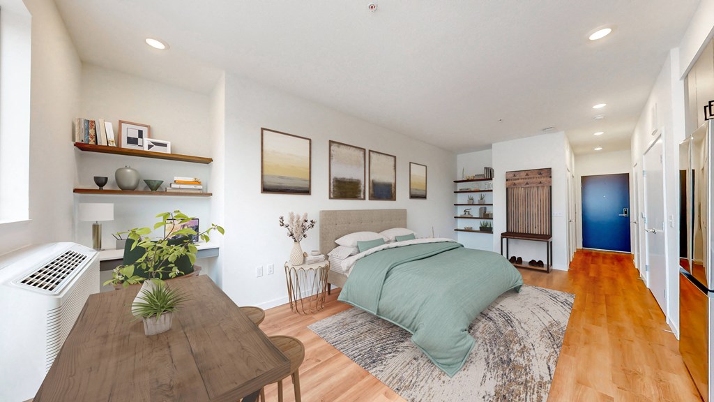 a bedroom with a bed and a wooden table