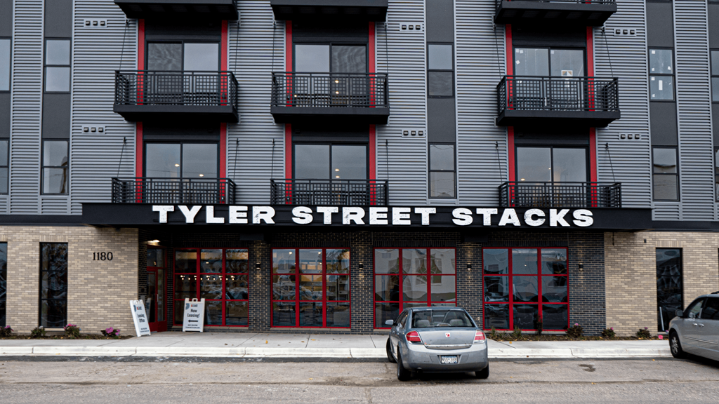 the facade of Tyler Street Stacks is shown in the city