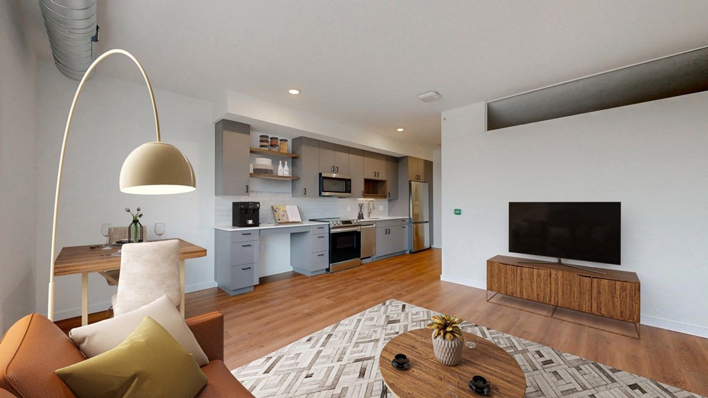 a living room with a couch and a table with a tv