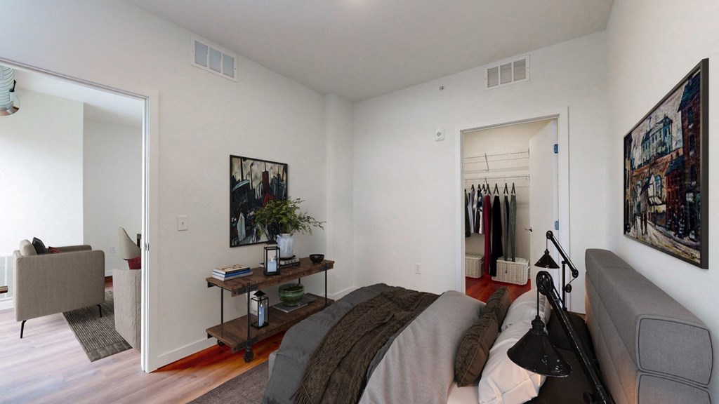 a bedroom with a bed and a closet