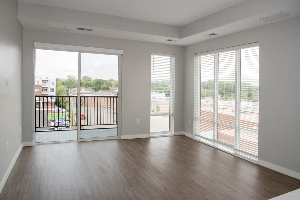 1 bedroom Joel living area with floor to ceiling windows at Urban Park I and II Apartments, Minnesota