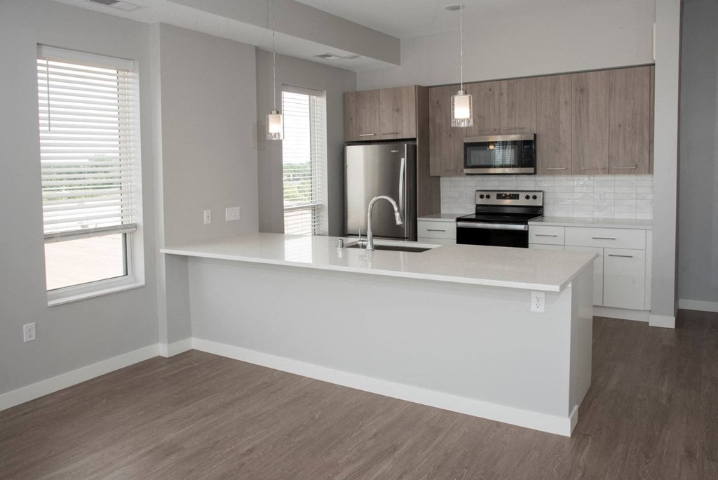1 bedroom joel kitchen with breakfast bar at Urban Park I and II Apartments, St Louis Park, MN, 55426