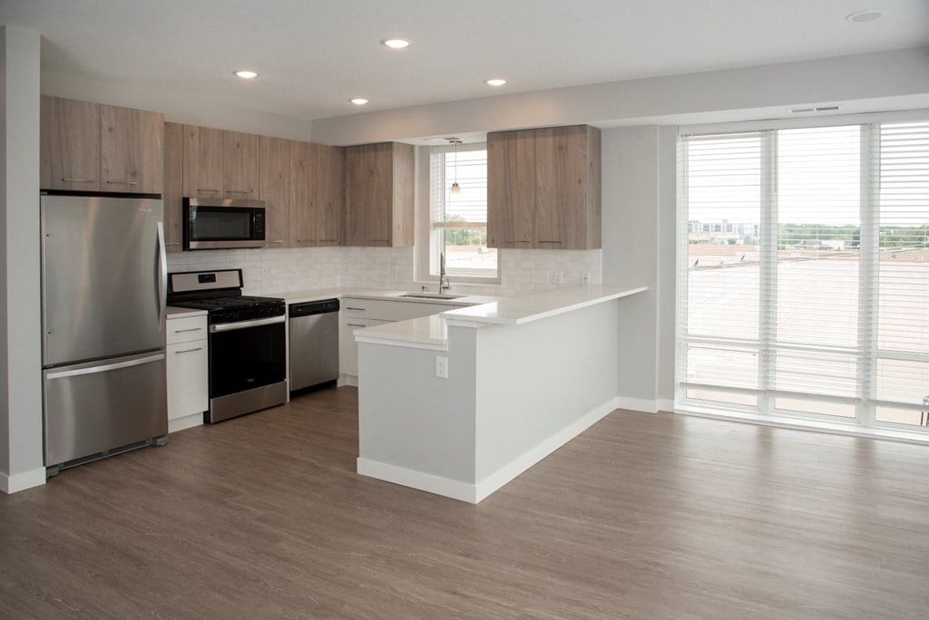 2 bedroom marc floor plan corner apartment with spacious kitchen, over the sink window and breakfast bar at Urban Park I and II Apartments, St Louis Park