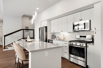 Fitted Kitchen With Island Dining Fitted Kitchen With Island Dining at Virdium Apartments, 721 N Third Street, Minneapolis - Photo Gallery 5