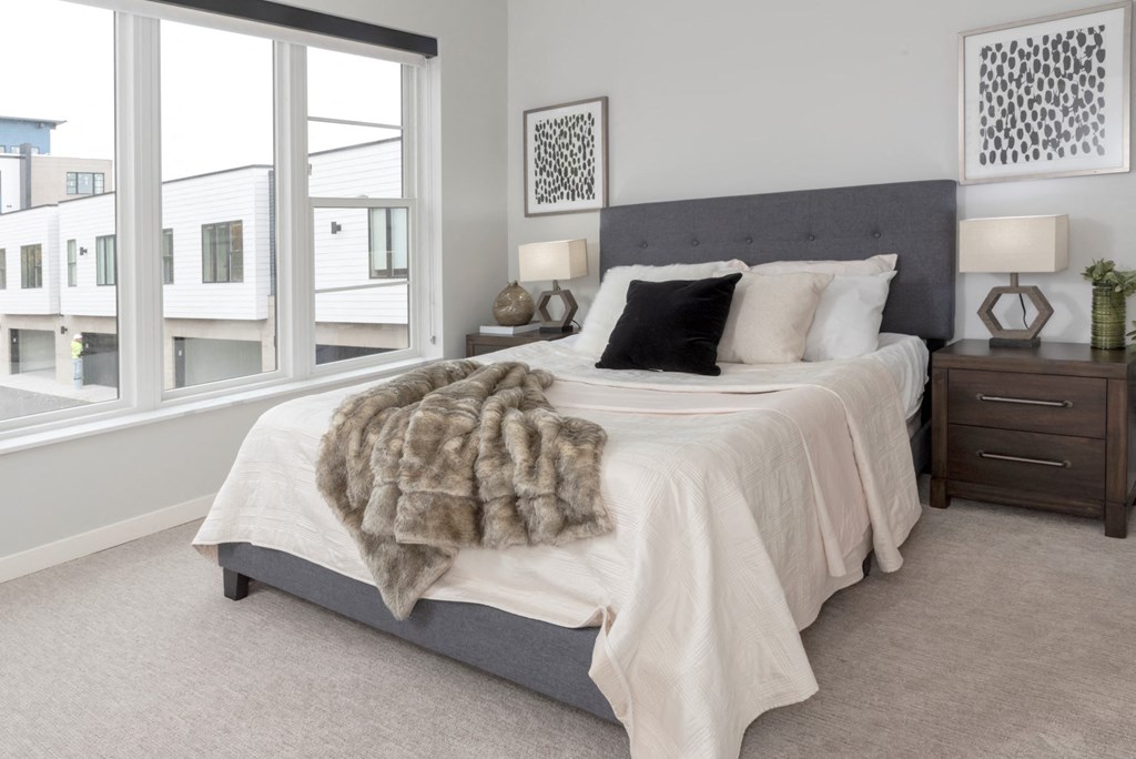 Bedroom with cozy bed at Volo at Texa Tonka Apartments , St Louis Park, 55426