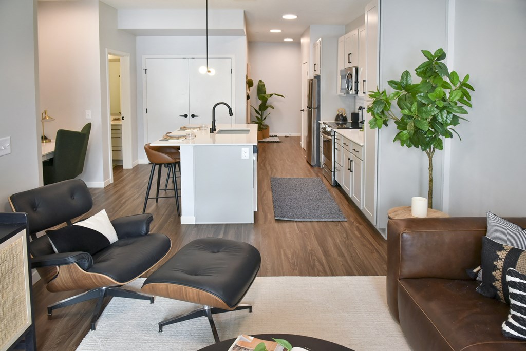 a living room and kitchen area in an apartment
