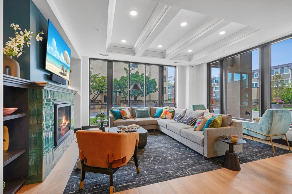 a living room with a couch and a fireplace