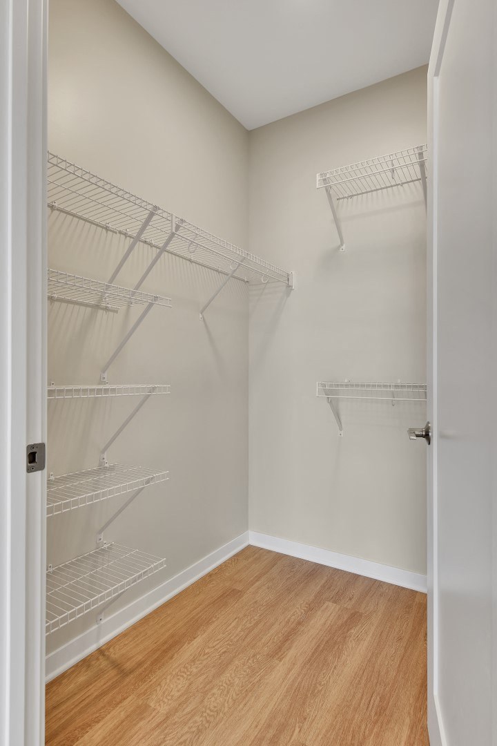 a walk in closet in a 555 waverly unit