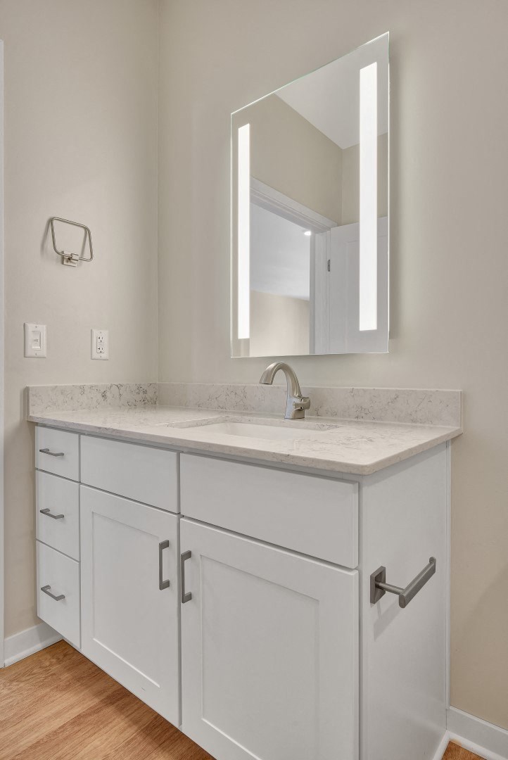 a bathroom with a sink and a mirror