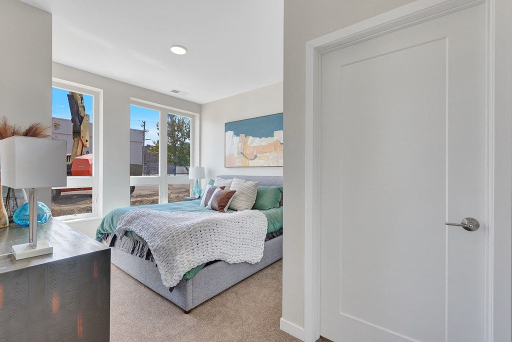 a bedroom with a large bed in a house