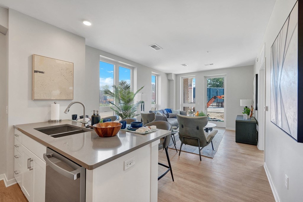 a kitchen and living room with a view of a construction site