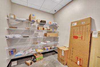A storage room with shelves and boxes.