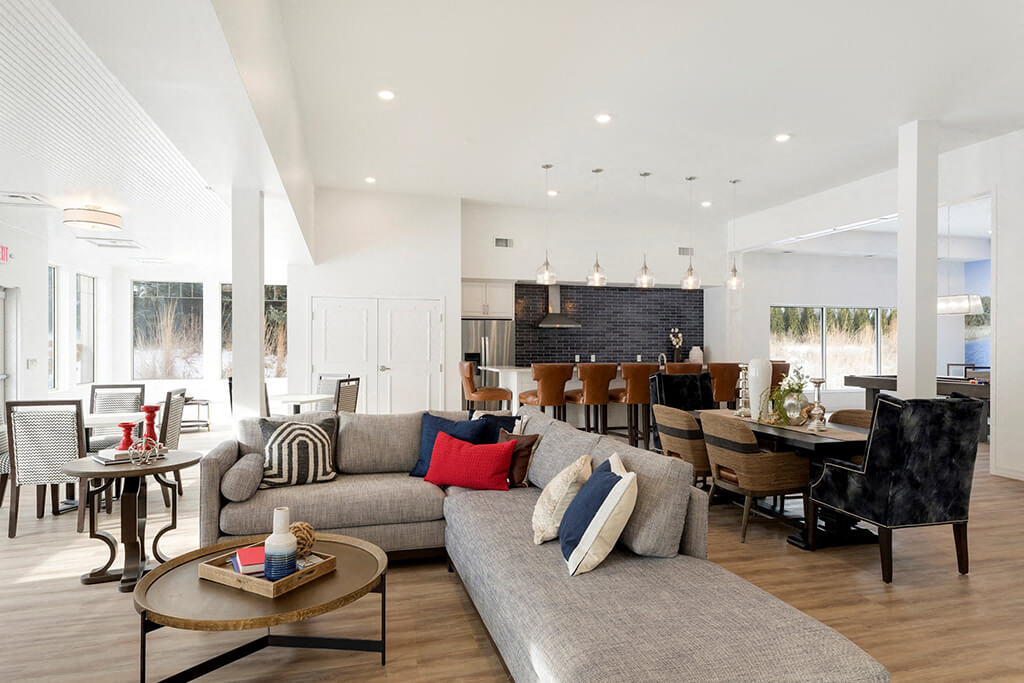 Large furnished clubroom with hardwood floors at Waterstone Place in MN 55305