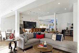 Bright clubroom with large grey sectional at Waterstone Place in Minnetonka, MN 55305