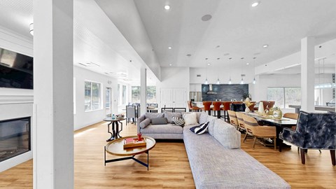 A modern living room with a grey sofa and a coffee table.