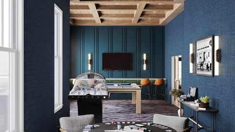 A room with a pool table and a television.