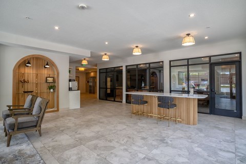 A spacious interior with a bar area and seating.