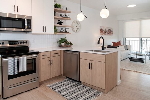 Fully Equipped Kitchen Includes Frost-Free Refrigerator, Electric Range, & Dishwasher at CityLine Apartments, Minnesota, 55406