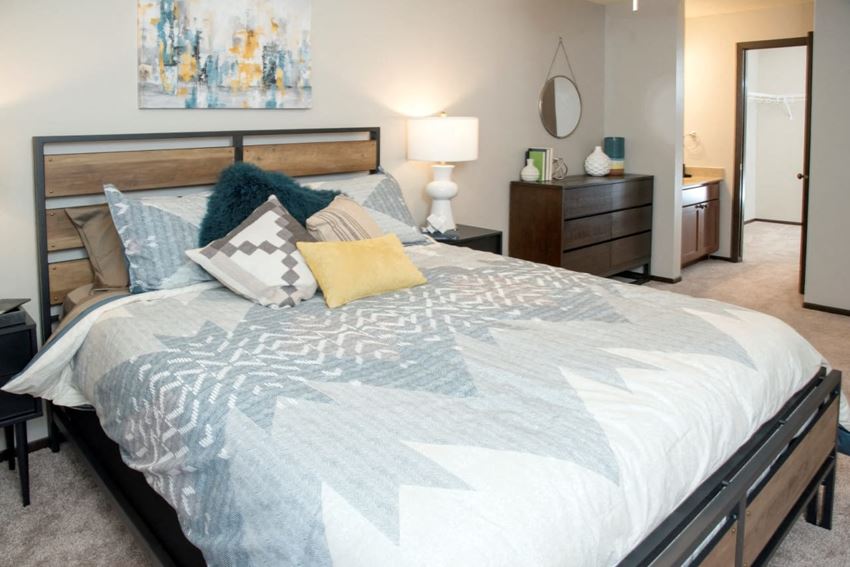 2 BR/1.25 BA - The Willow, master bedroom with walk-in closet and sink Master bedroom with walk-in closet and sink, Aspenwoods Apartments, Eagan, MN