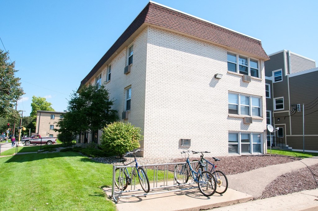 three bikes parked in front of a building