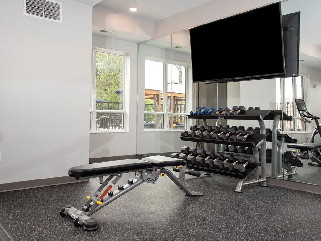 fitness room with weightsat Urban Park I and II Apartments, St Louis Park, Minnesota