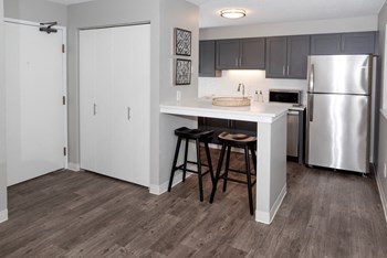Gourmet Kitchen With Island at Audenn Apartments, Bloomington, 55438 - Photo Gallery 6