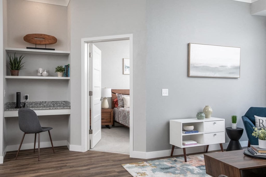 A room with a bed, a desk, and a chair.at The Edison at Maple Grove, Maple Grove, 55311