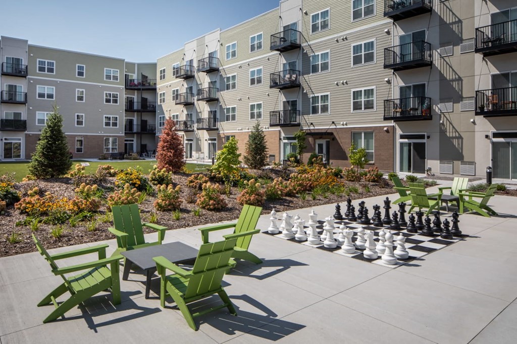 A chess set is set up on a patio at The Edison at Rice Creek I and II, Shoreview, 55126
