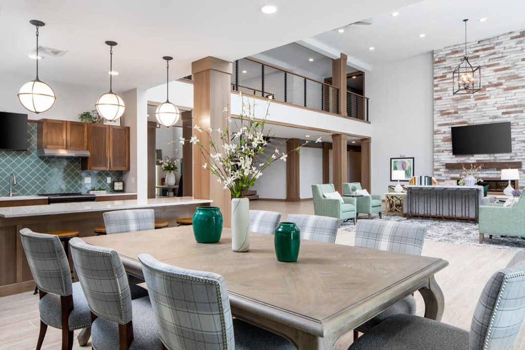 A modern dining room with a large table and chairs at The Edison at Rice Creek I and II, Shoreview