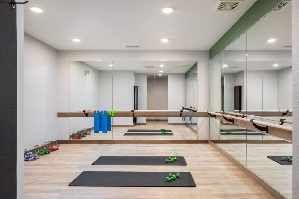 A yoga studio with mats and blocks on the floor.at The Edison at Rice Creek I and II, Minnesota